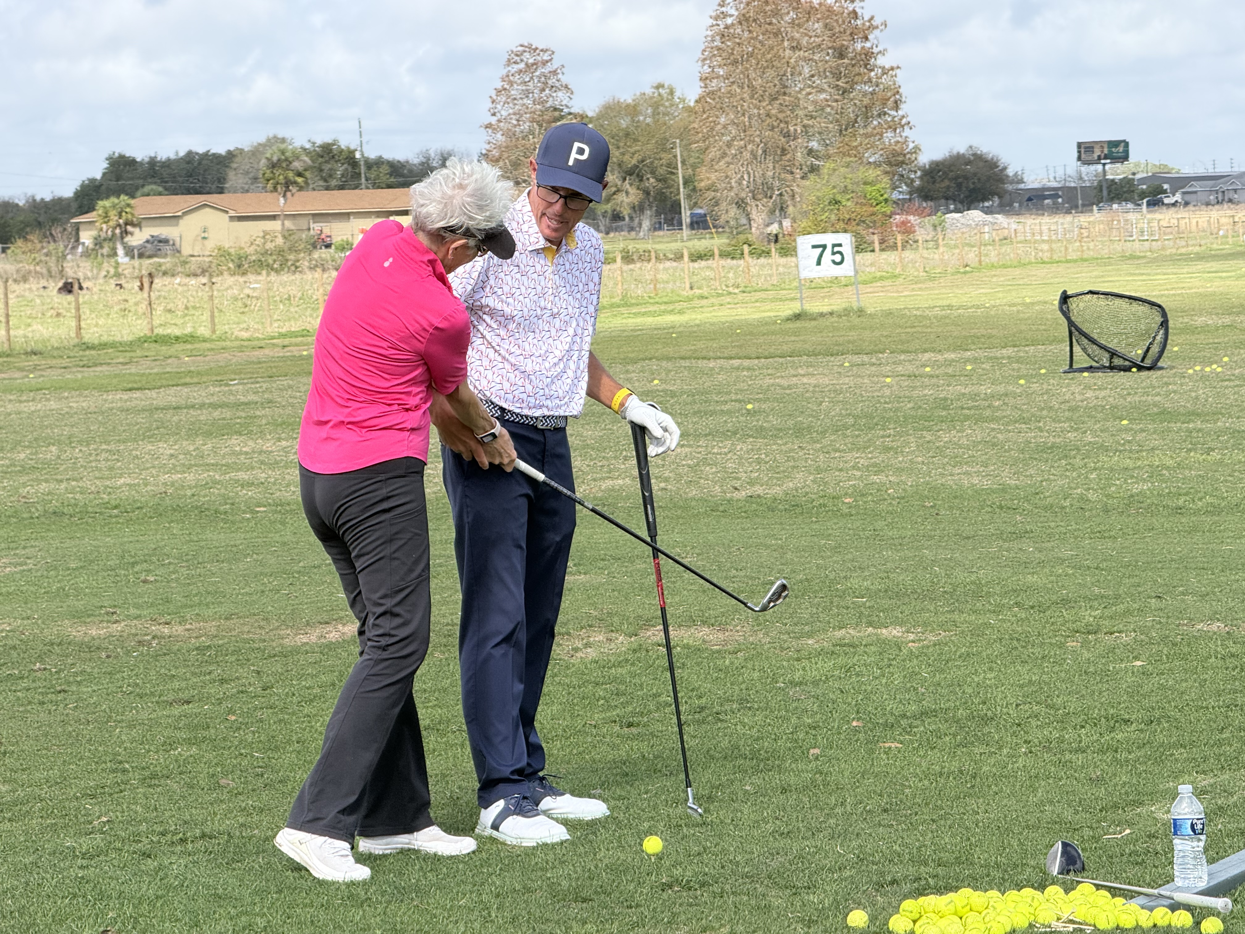 Adult golf coaching session